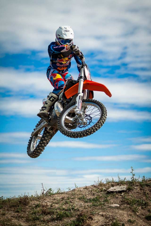 Alex on location with his motocross bike.